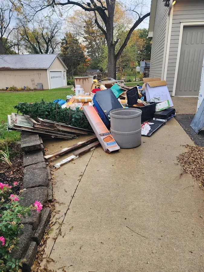 Dumpster being loaded with debris for Residential Dumpster Rental in Ettrick